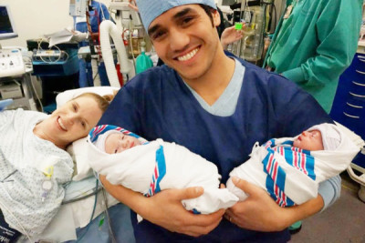 Adam Jacobs and his wife, actress Kelly Jacobs, with their new twin sons, Jack and Alex. (courtesy of Disney Theatricals)